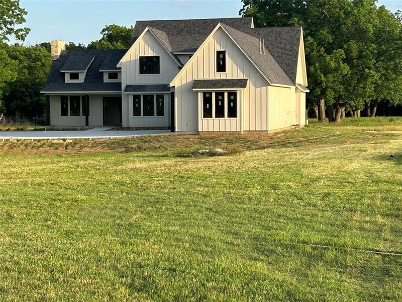 Front exterior of a new home in , Whitesboro, TX, highlighting curb appeal (Image 1). Front exterior of a new home in , Whitesboro, TX, highlighting curb appeal (Image 1).