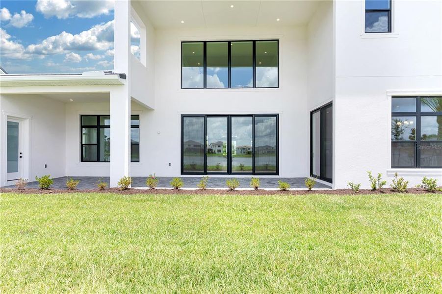 Front exterior of a new home in , Orlando, FL, highlighting curb appeal (Image 23).