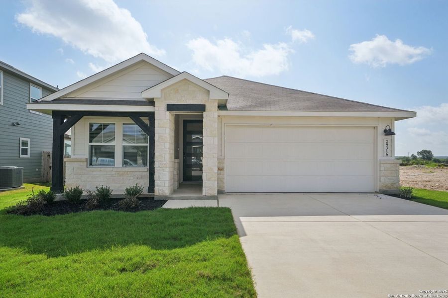 Front exterior of a new home in Estancia Ranch - Premier Series, San Antonio, TX, highlighting curb appeal (Image 1).