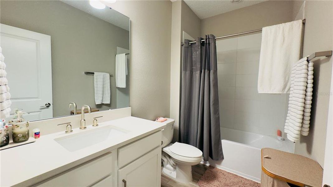 Furnished interior view inside a new home in Harvest at Ovation, Winter Garden (Image 56).