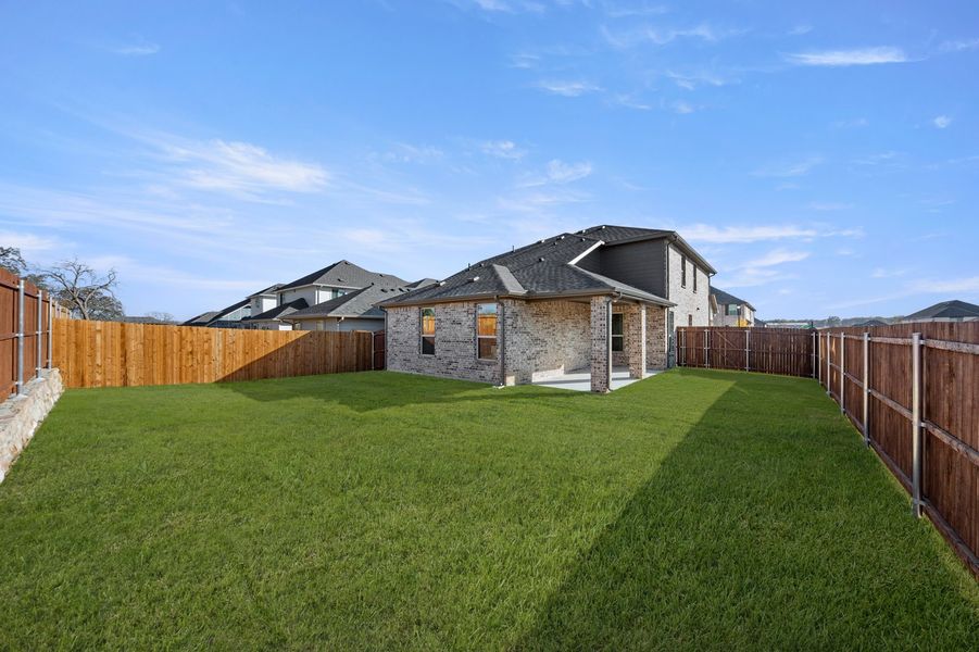Front exterior of a new home in Keeneland, Aubrey, TX, highlighting curb appeal (Image 27). Front exterior of a new home in Keeneland, Aubrey, TX, highlighting curb appeal (Image 27).