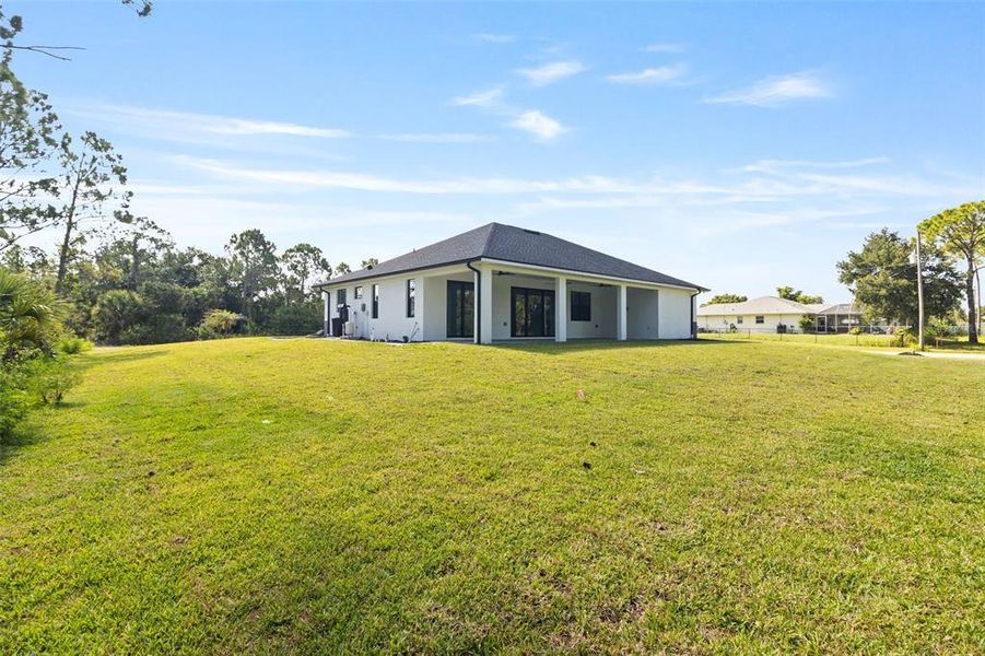 Exterior details and patio area of a home in , North Port (Image 24).