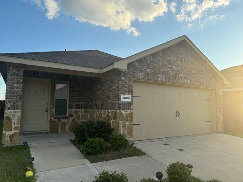 View of front facade featuring a garage