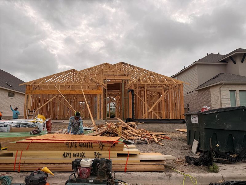 Witness the beginning of a future home with sturdy wood framing reaching towards the sky. Witness the beginning of a future home with sturdy wood framing reaching towards the sky.