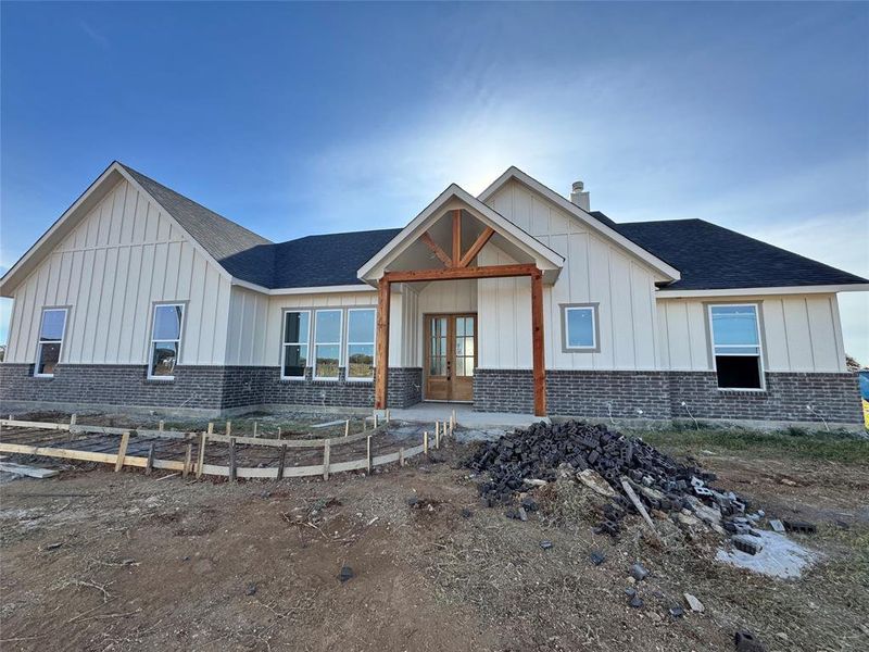 View of front facade featuring french doors