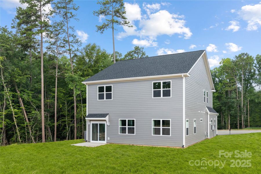 Front exterior of a new home in , Hickory, NC, highlighting curb appeal (Image 1).