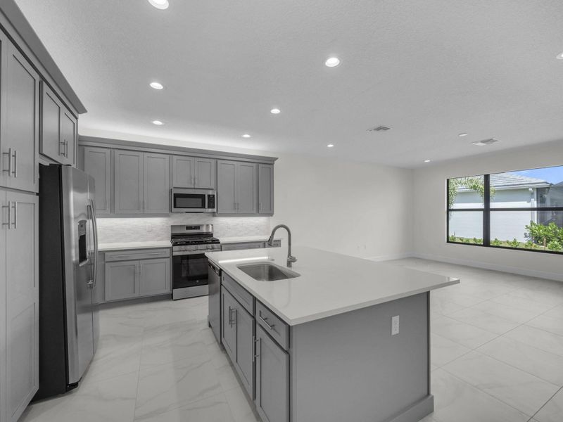 Furnished interior view inside a new home in Valencia Parc at Riverland, Port St. Lucie (Image 8).