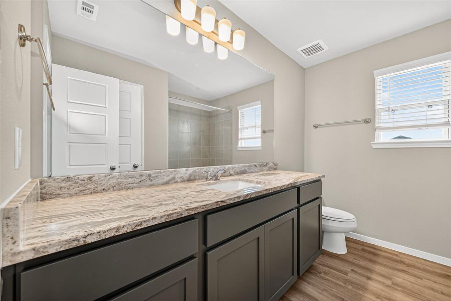 Furnished interior view inside a new home in Sunterra, Katy (Image 8).