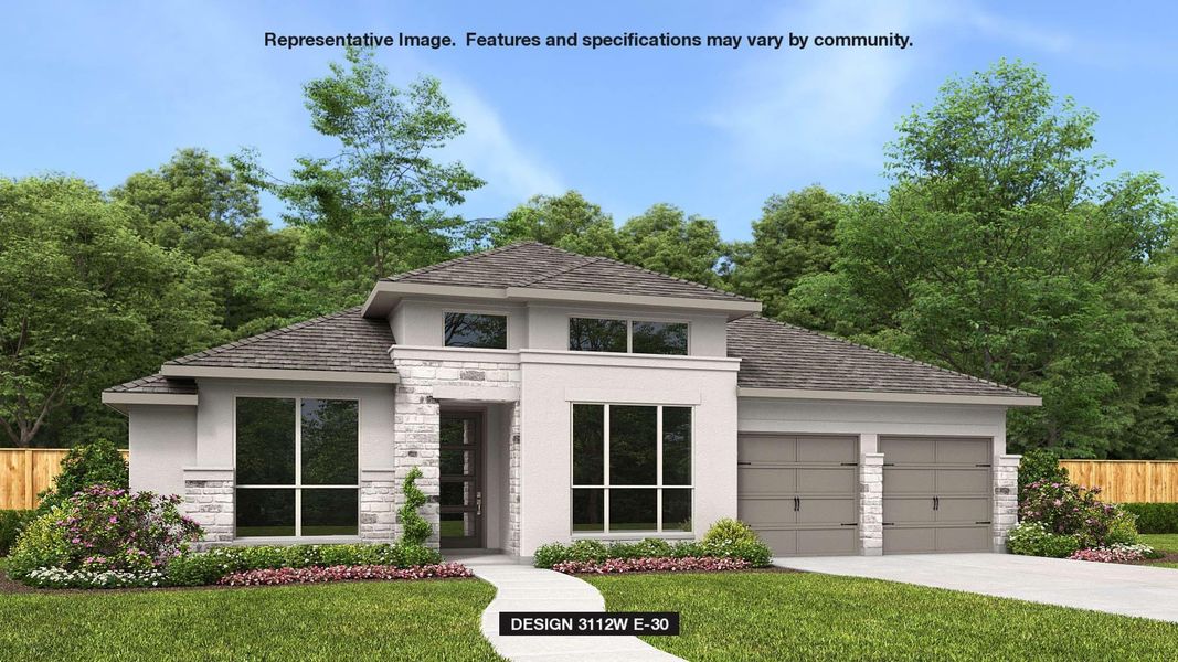 View of front of house featuring a garage and a front lawn