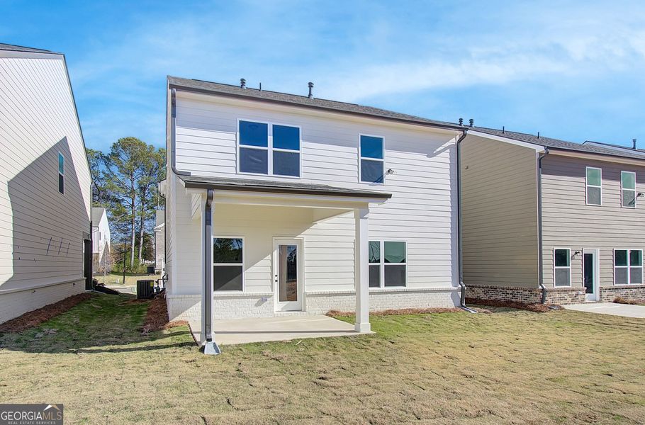 Front exterior of a new home in Crofton Place Enclave, Snellville, GA, highlighting curb appeal (Image 20).