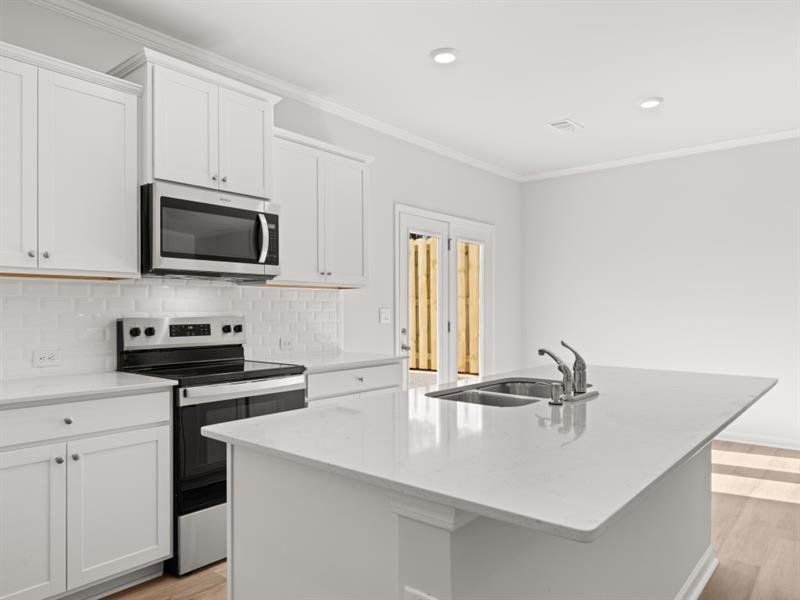 Furnished interior view inside a new home in Waypoint, Flowery Branch (Image 10).