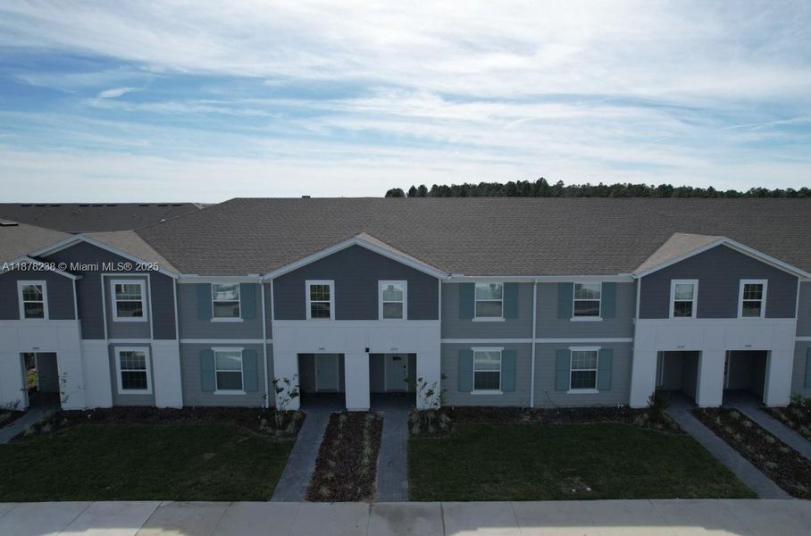 Front exterior of a new home in , Davenport, FL, highlighting curb appeal (Image 19).