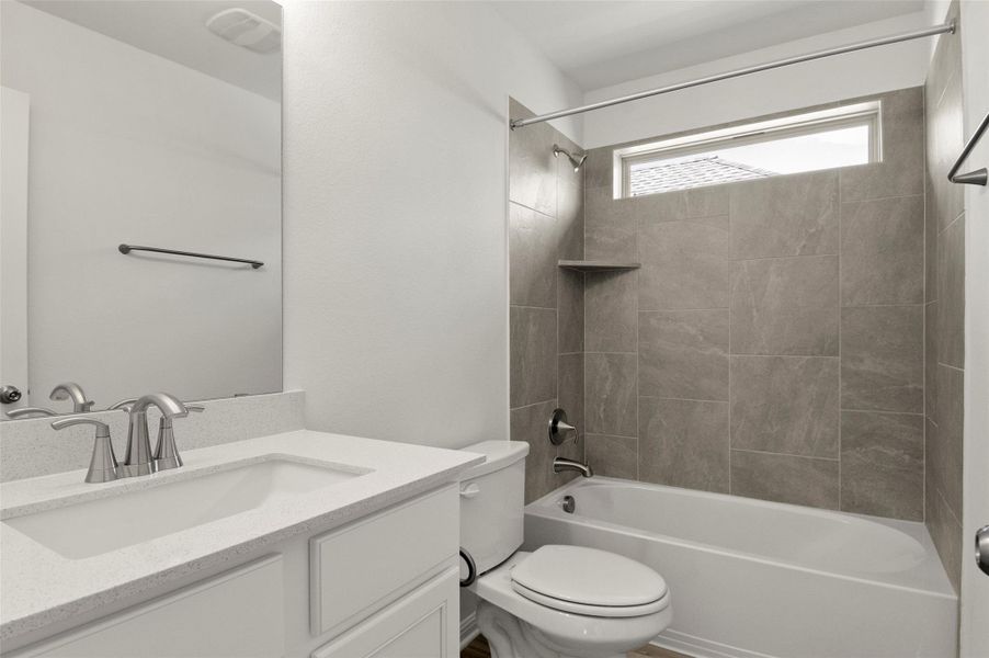 Bathroom with vanity and  shower combination