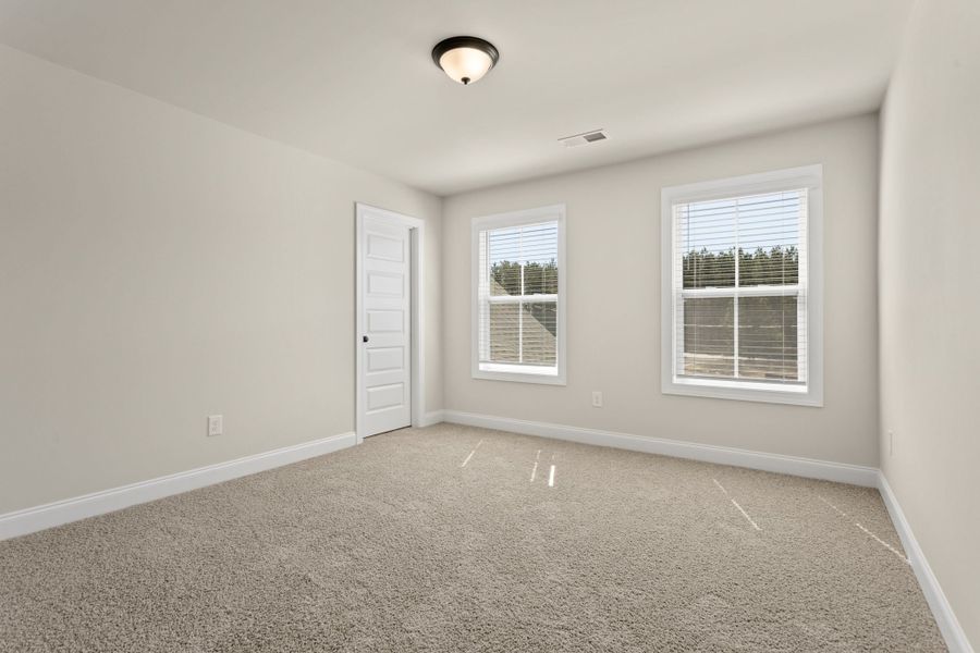 Spacious, unfurnished interior of a new home in Cherokee Knoll, Williamston (Image 26).