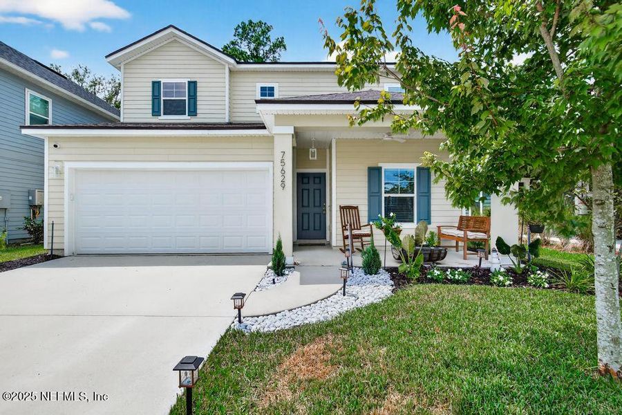 Front exterior of a new home in Tributary, Yulee, FL, highlighting curb appeal (Image 23).