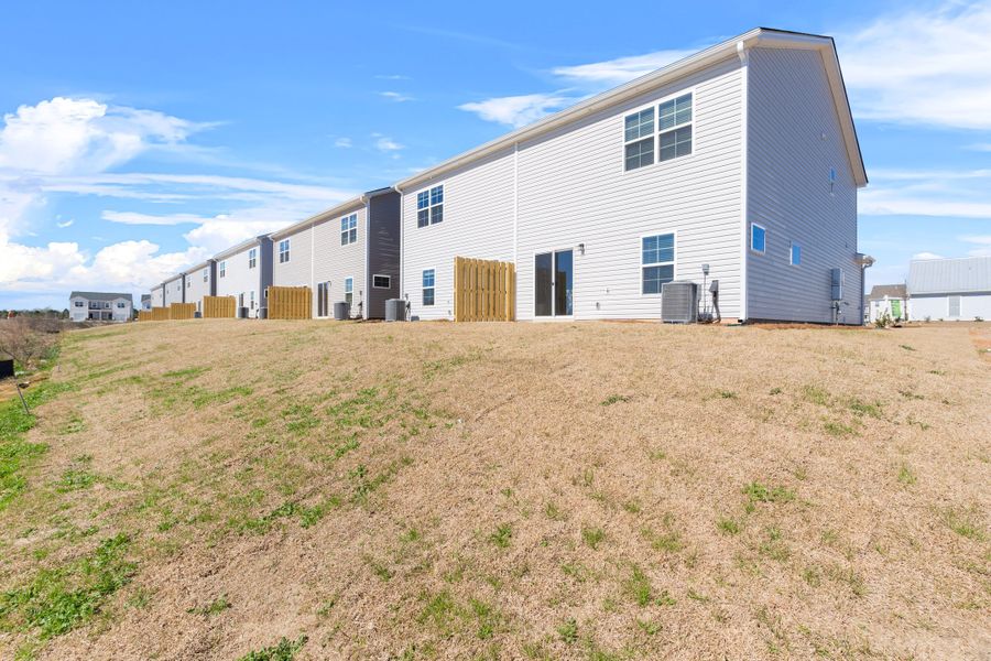 Front exterior of a new home in Hunters Branch Townhomes, Hopkins, SC, highlighting curb appeal (Image 24).