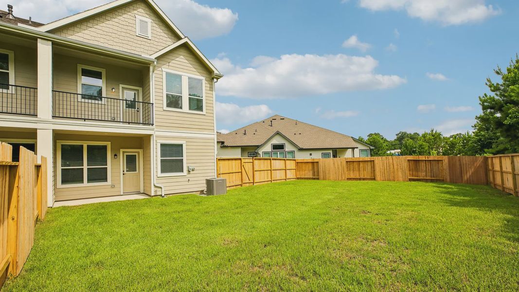 Exterior details and patio area of a home in Woodforest, Montgomery (Image 21).