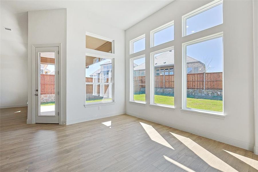 Doorway to outside featuring baseboards and wood finished floors