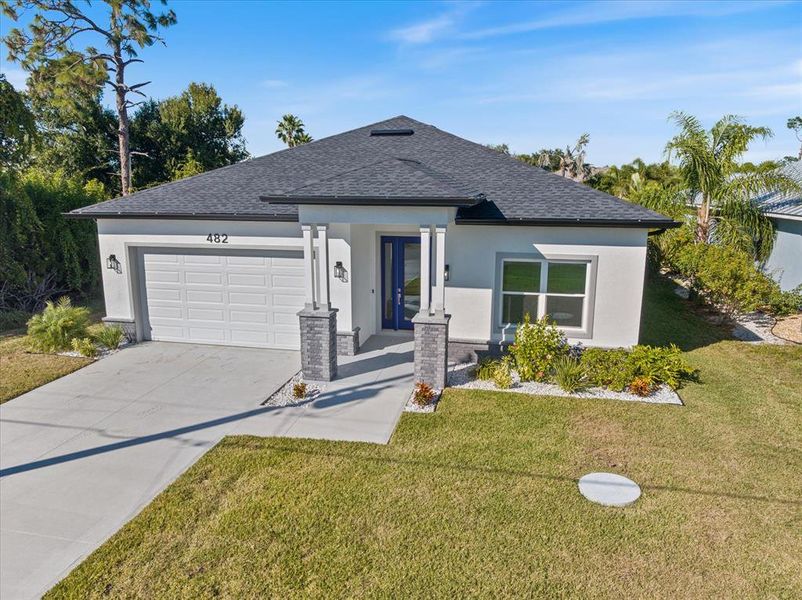 Front exterior of a new home in , Rotonda West, FL, highlighting curb appeal (Image 25).
