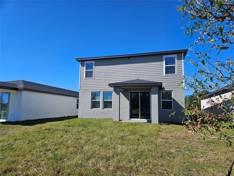 Exterior details and patio area of a home in The Reserve at Hammock Oaks - Classic Series, Lady Lake (Image 27).