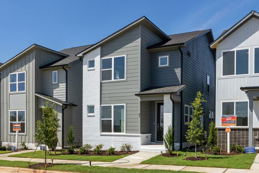 Front exterior of a new home in NoVi Chatham Park - The Mews Collection, Pittsboro, NC, highlighting curb appeal (Image 17). Front exterior of a new home in NoVi Chatham Park - The Mews Collection, Pittsboro, NC, highlighting curb appeal (Image 17).