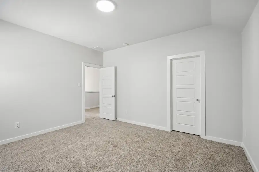 Bedroom in the Wimbledon home plan by Trophy Signature Homes