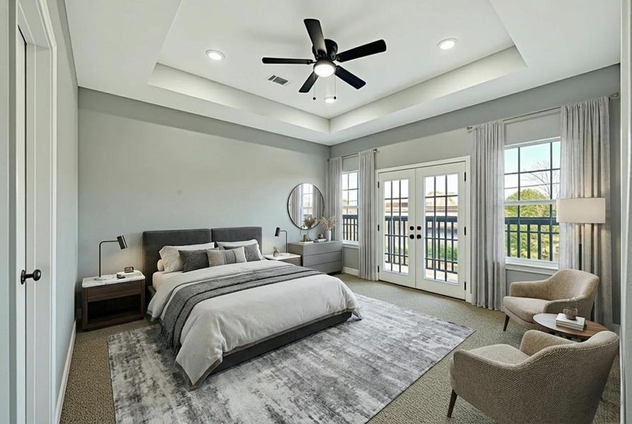 This spacious Primary bedroom features a modern ceiling design with staged cozy bed, elegant armchairs, and a stylish area rug. It boasts large windows and French doors leading to a balcony, providing ample natural light. The room is complemented by a ceiling fan and subtle recessed lighting.