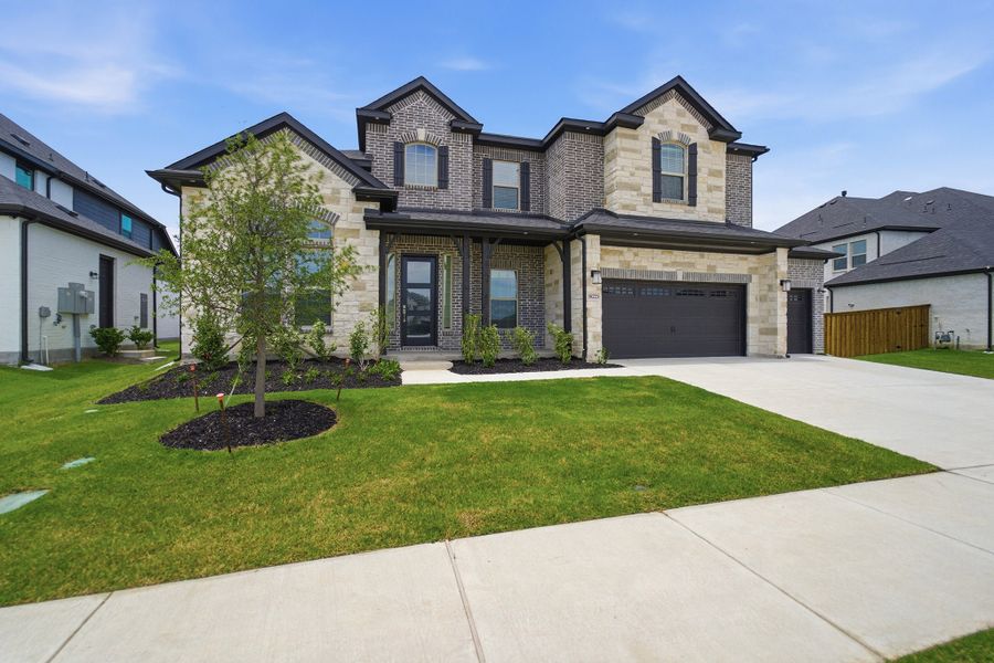 Front exterior of a new home in Green Meadows, Celina, TX, highlighting curb appeal (Image 26). Front exterior of a new home in Green Meadows, Celina, TX, highlighting curb appeal (Image 26).