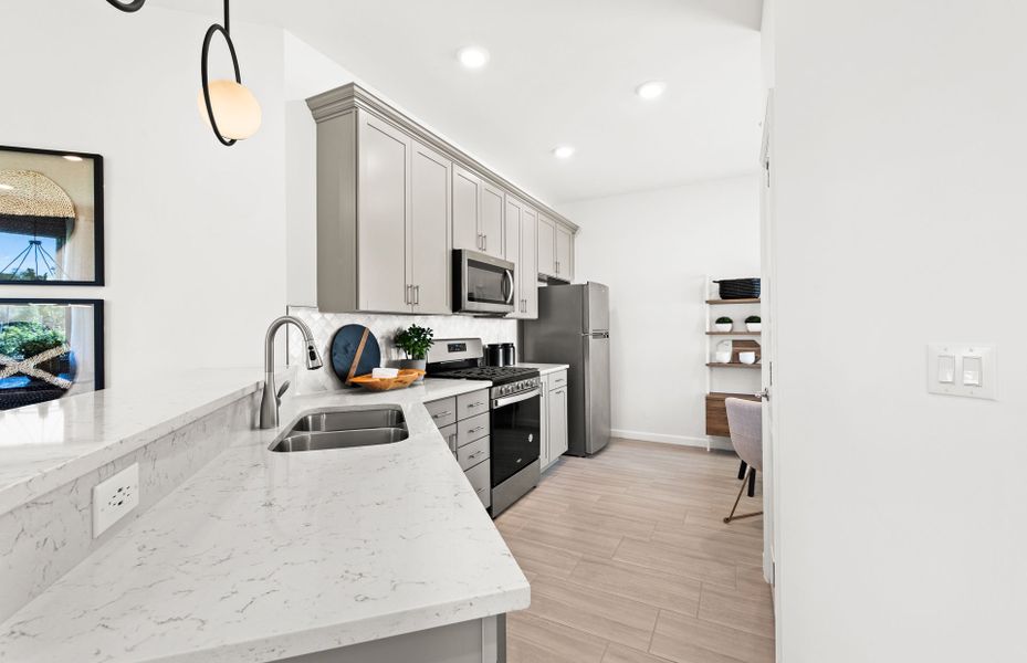 Representative furnished interior of a home built from the Cascadia by DiVosta in BeachWalk by Manasota Key, Englewood (Image 38).