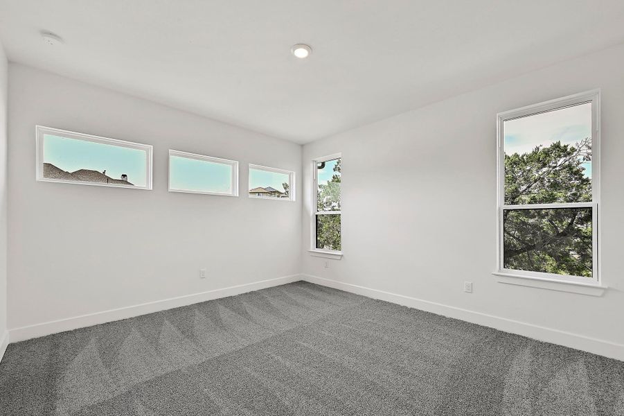 Spacious, unfurnished interior of a new home in Rough Hollow, Austin (Image 22).