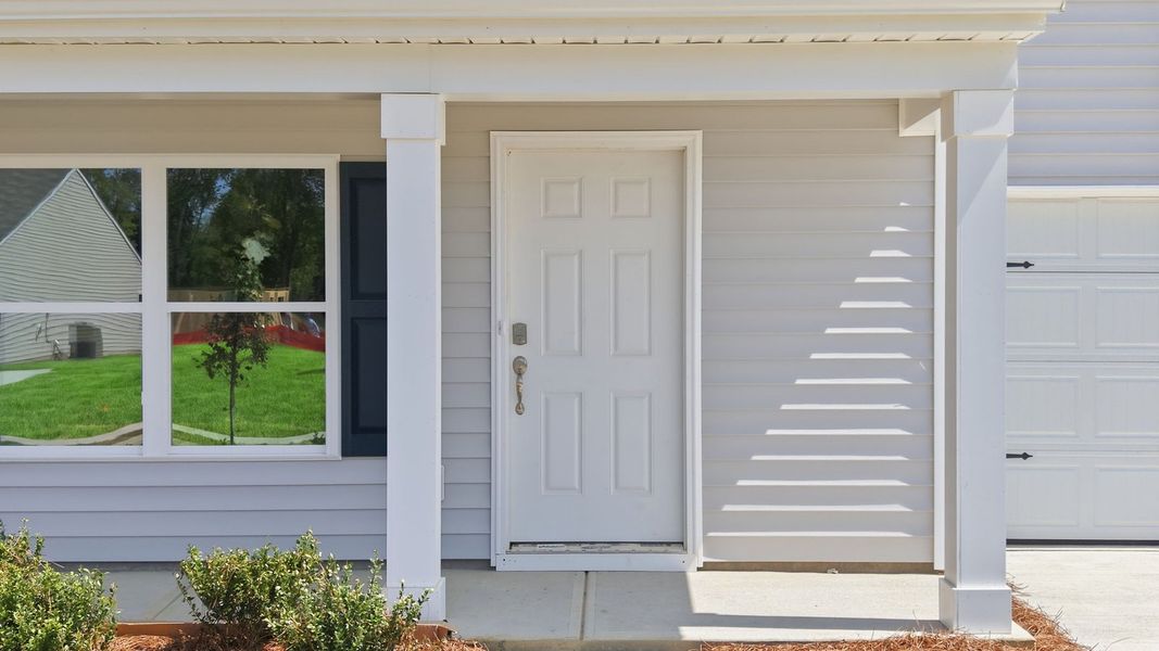 Exterior details and patio area of a home in Hobbs Farm, Ayden (Image 3).
