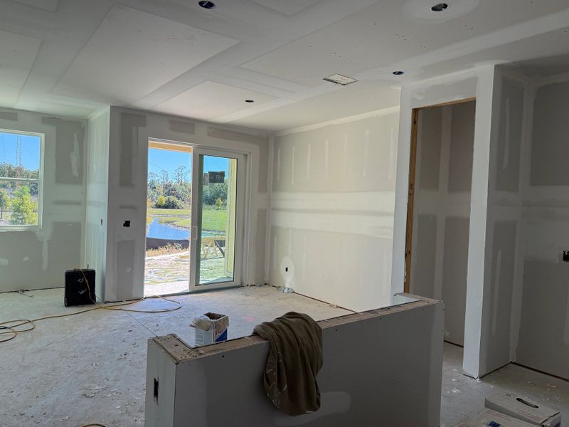 Foyer transitions into open kitchen and living area