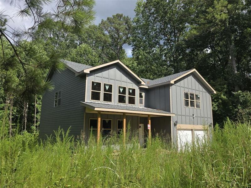 Front exterior of a new home in , Atlanta, GA, highlighting curb appeal (Image 1).