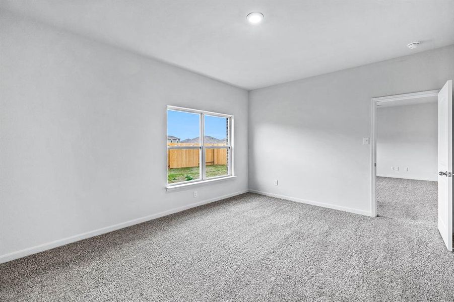 Empty room featuring carpet floors