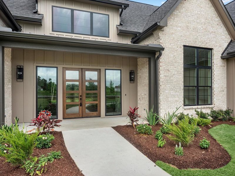 Inviting front porch for guests and lots of room for Amazon packages.
