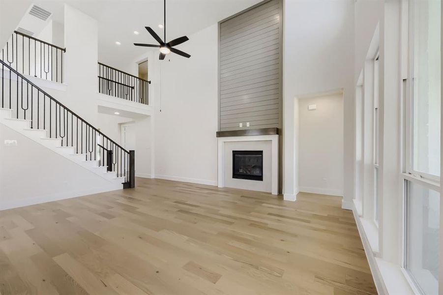 Two-story living area with wood-finish flooring