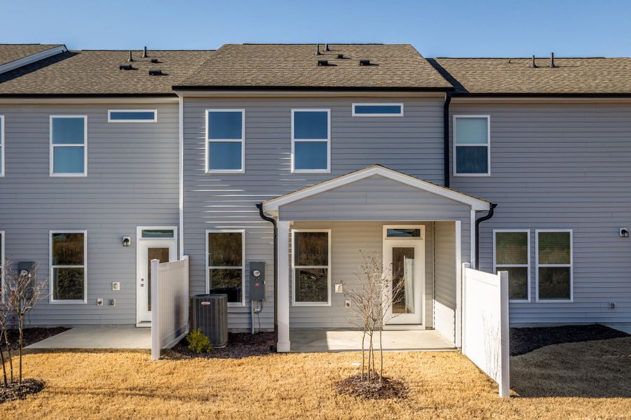Exterior details and patio area of a home in 1158 Place Townhomes, Wilson (Image 3).