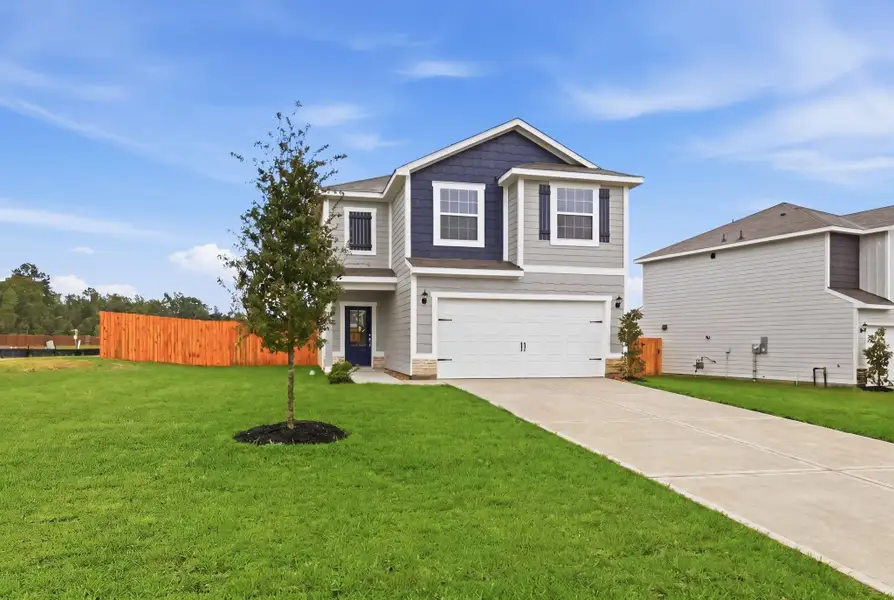 Front exterior of a new home in Magnolia Woods, Magnolia, TX, highlighting curb appeal (Image 1). Front exterior of a new home in Magnolia Woods, Magnolia, TX, highlighting curb appeal (Image 1).