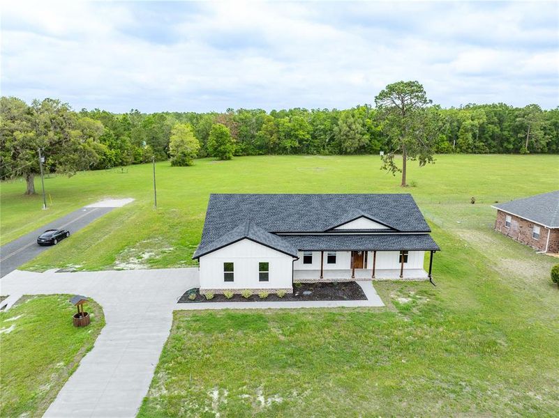 Front exterior of a new home in , Lake City, FL, highlighting curb appeal (Image 27).