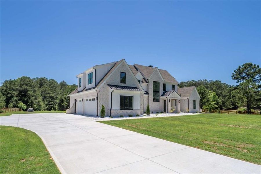 Front exterior of a new home in , Monroe, GA, highlighting curb appeal (Image 30).