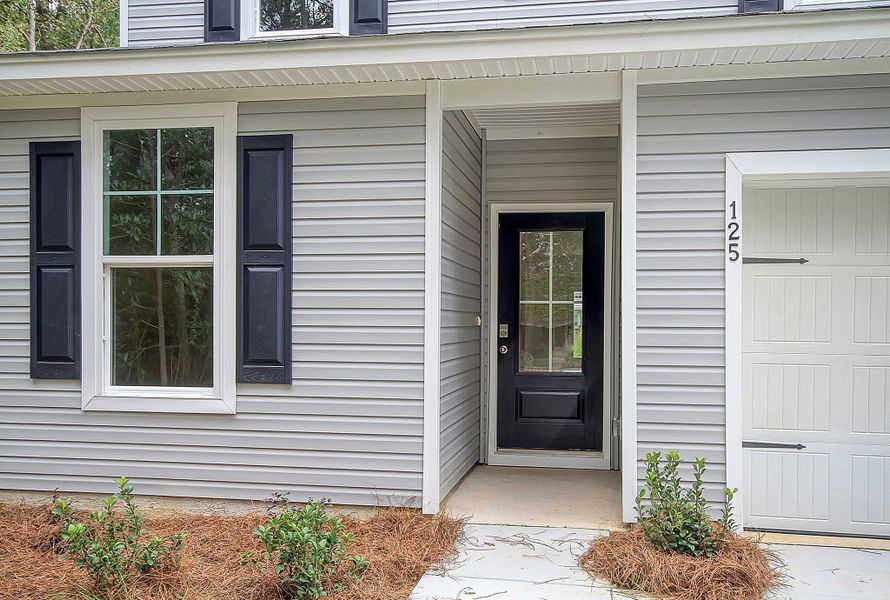 Exterior details and patio area of a home in Founder's Park, Lincolnville (Image 3).
