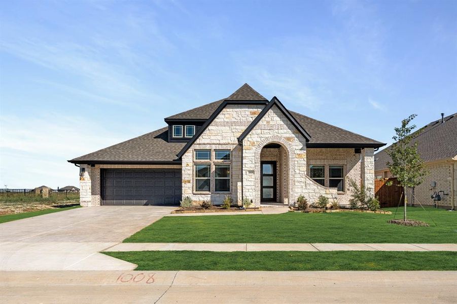 Front exterior of a new home in Timberbrook 3B-4A, Justin, TX, highlighting curb appeal (Image 2).