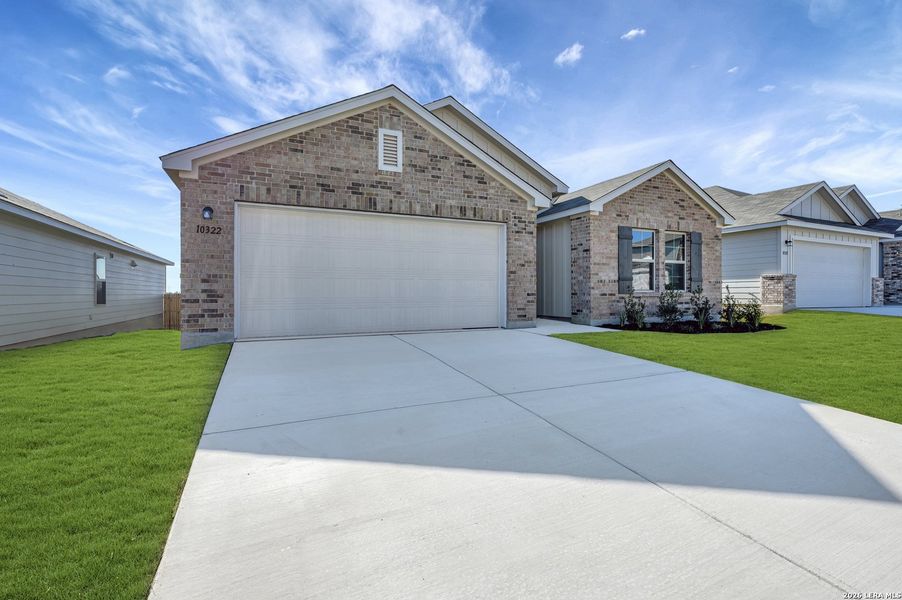 Front exterior of a new home in Paloma Park, Converse, TX, highlighting curb appeal (Image 20).