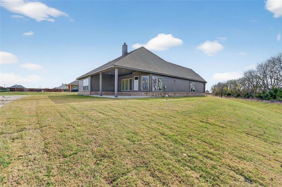 Exterior details and patio area of a home in Nash Estates, Tom Bean (Image 31).