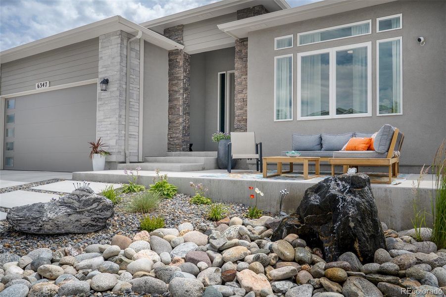 Front exterior of a new home in , Colorado Springs, CO, highlighting curb appeal (Image 1).