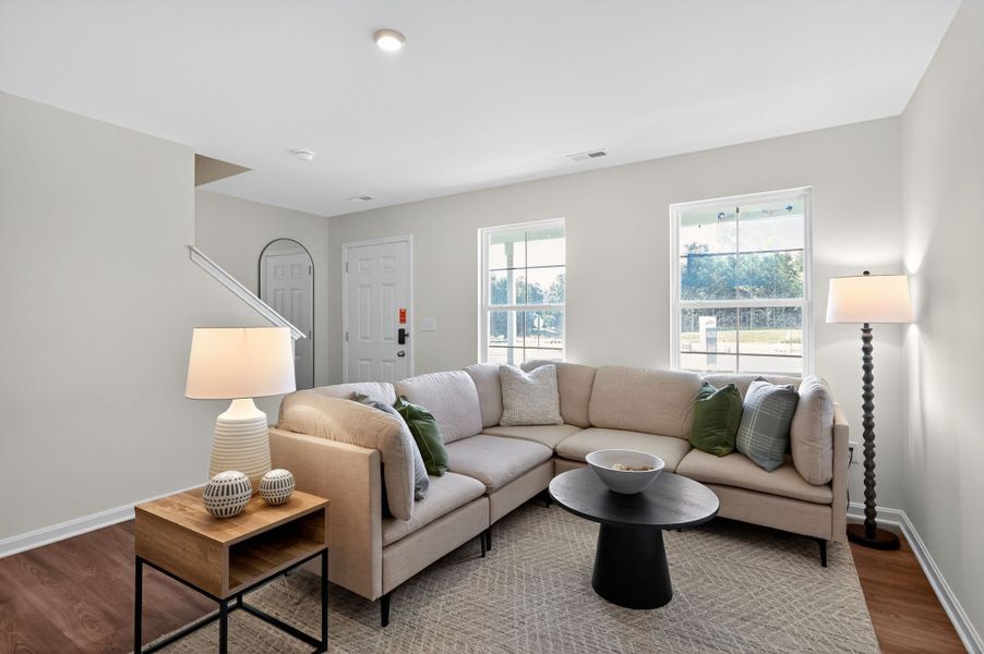 A living room with a couch and a coffee table.