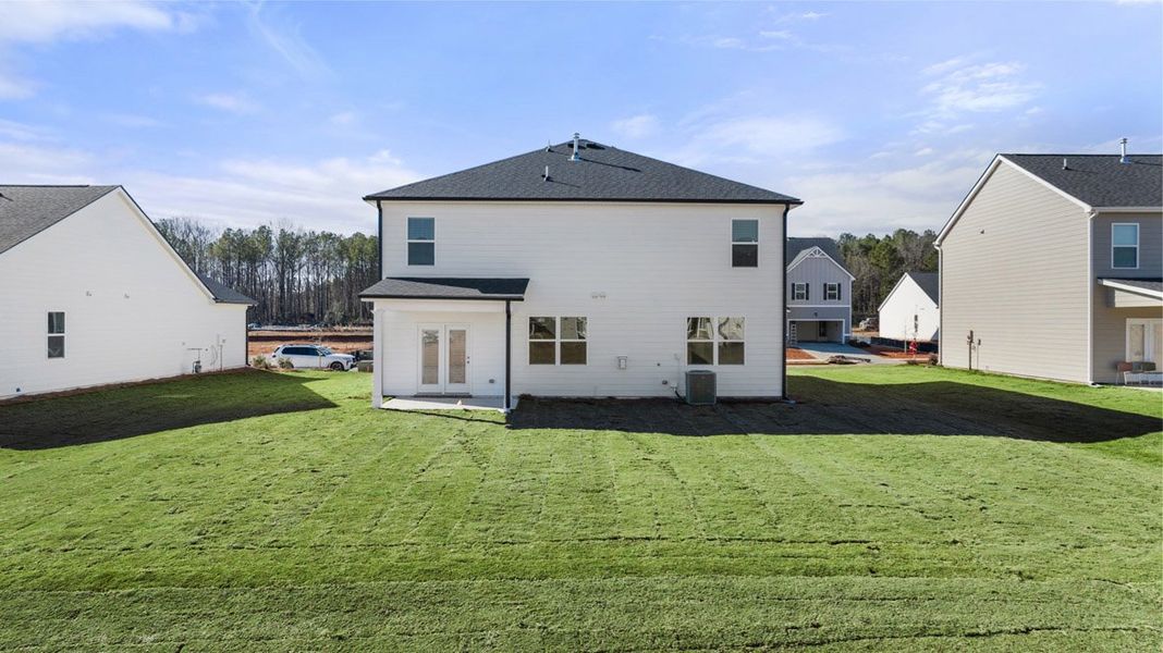 Exterior details and patio area of a home in Estates at Deer Hollow, Grovetown (Image 2).