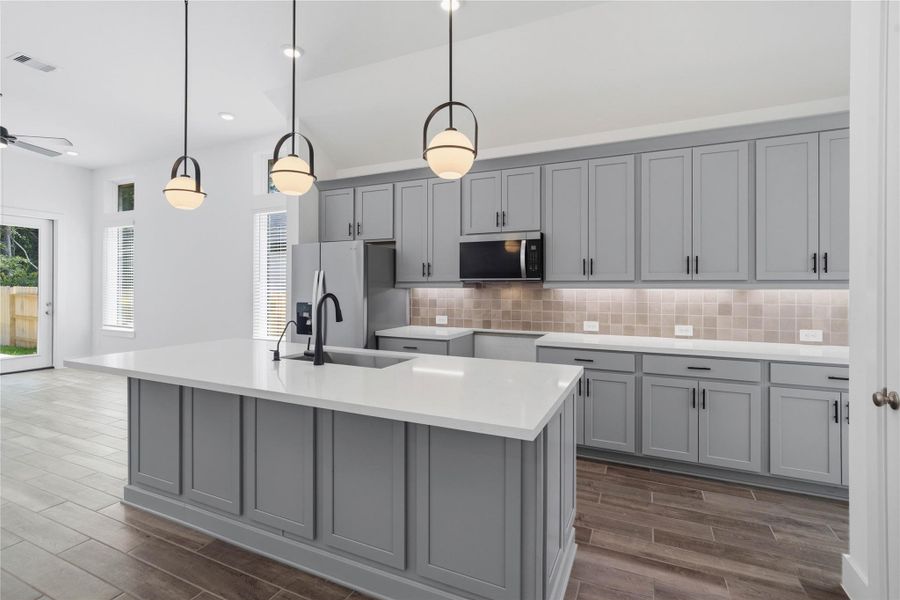 Designed to be the heartbeat of daily life, this light-filled kitchen combines high-end functionality with a warm, welcoming ambiance. Designed to be the heartbeat of daily life, this light-filled kitchen combines high-end functionality with a warm, welcoming ambiance.
