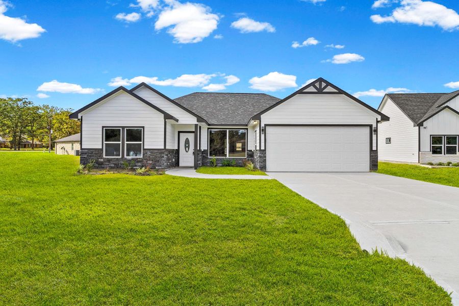 Front exterior of a new home in , Trinity, TX, highlighting curb appeal (Image 2).