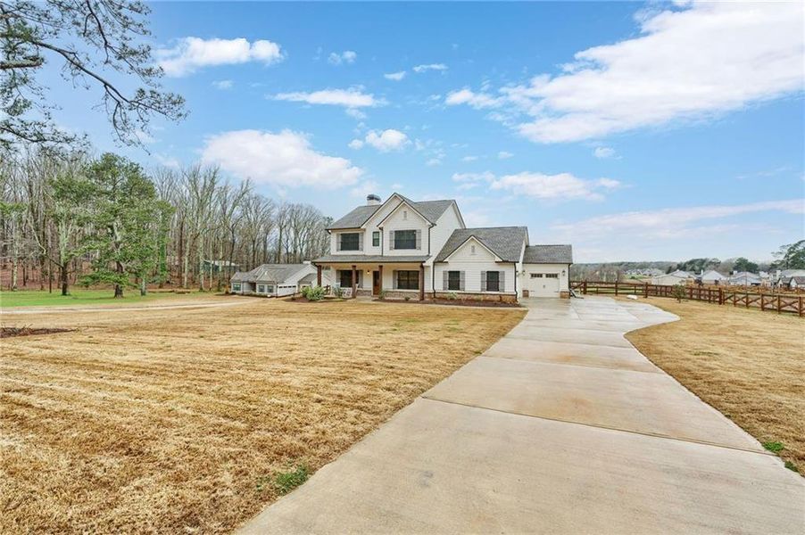Front exterior of a new home in Alcovy Station, Covington, GA, highlighting curb appeal (Image 27).